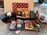 Full lot including various game and toy items arranged on floor showing the majority of the lot's content.