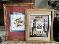Both framed paper tole artworks side by side on carpet floor showing wooden oak frames and double matting for each piece.