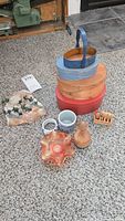 Full lot including Shaker boxes, basket, pottery, carnival glass dish, wooden stamp, and rock decor with metal ivy vine