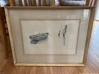 Full front view of framed watercolor painting depicting a boat and pilings