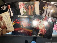 Photo showing six vinyl albums including two Tony Bennett Greatest Hits albums, two Diana Ross albums, a Neil Diamond 'Beautiful Noise' album, and a Tony Orlando & Dawn Greatest Hits album.