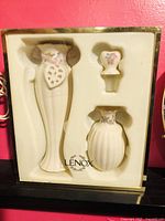 Photo of Lenox gift set showing 8 inch vase with hanging heart ornament, 6 inch ribbed vase, and small stopper in original foam packaging.