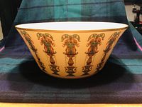 Side view of the Lenox salad bowl showing ornate urn pattern and gold trim