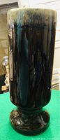 Tall olive brown drip glazed utensil holder or vase with glossy finish, mounted on round pedestal base