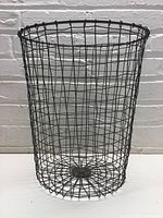 Front view of cylindrical wire trash can showing wire grid construction and dimensions