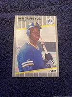 Front of Ken Griffey Jr. rookie Fleer baseball card #548 showing player in Mariners uniform holding bat