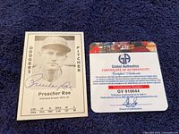 Front of Don Russ baseball card with Preacher Roe photo and autograph, alongside Global Authentics COA card.
