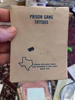 Cover page of the booklet showing title 'Prison Gang Tattoos' and Texas Department of Public Safety Criminal Intelligence Service details.