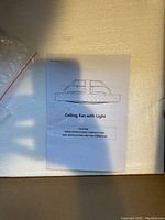 Instruction manual titled 'Ceiling Fan with Light' explaining safe installation and operation.
