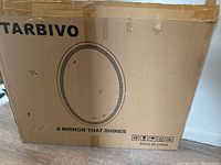 Cardboard shipping box labeled Starbivo, showing product image and branding with the words 'A mirror that shines'.