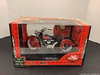 Front view of the die cast Indian Chief 348 motorcycle model in original red and black Gulfoy box showing clear display window and Made in Spain label.