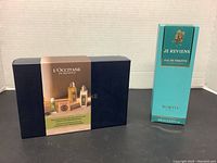 Closed L'Occitane gift box and Je Reviens Eau de Toilette packaging.