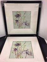 Two matching framed floral art prints stacked with visible 11x11 size, new condition.