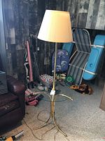 Full view of the floor lamp and glass table, showing overall condition and style.