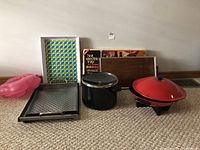 Group view showing all items including trays, pot, wok, and electric tray