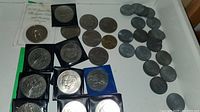 Overview of commemorative coins in sleeves and loose pre-decimal coins