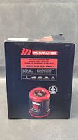 Original product box showing MOTOMASTER branding and product features information on side panel, including quiet operation, preset tire pressure.