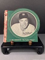 Front cover page showing Joe DiMaggio portrait with green border and caption “Joe DiMaggio ‘The Yankee Clipper’”