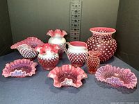 Full set of 9 vintage pink hobnail glass items arranged with measuring scale showing heights up to about 7 inches.