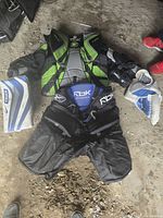 Overhead layout of Bauer pads, blocker, catcher, Reebok chest protector and pants