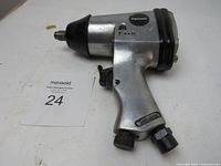 Front and side view of used Powermate 1/2 inch impact tool with visible F-R switch and Powermate logo.