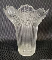 Front view of clear glass MCM flower vase with textured bubble and ribbed details, petal-shaped rim.