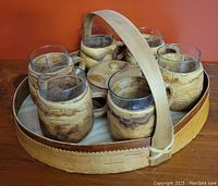 Full set on wooden surface with all cups, sugar bowl, and tray with handle visible