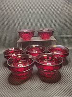 Group photo showing 8 bowls arranged in a pyramid formation on a textured backdrop.