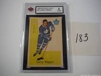 Front view of 1959-60 Parkhurst Larry Regan hockey card in protective KSA case, graded 4 VGE.