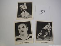 Three hockey cards arranged on a white background, showing players Al Langlois, Forbes Kennedy, and Ron Stewart. Cards are from the mid 1960s Coca-Cola set.