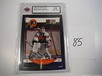 Photo shows front view of 1990-91 Pro Set #216 Ron Hextall hockey card in protective slab with Gem Mint 10 grade.