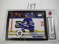 Front of the graded 2019-2020 Upper Deck Auston Matthews hockey card showing the player in blue uniform.