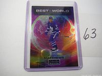 Front of 2021 OPC Platinum Best Of Both Worlds Auston Matthews hockey card in clear protective sleeve, showing holographic rainbow foil and player action image.