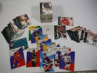 Overview photo showing multiple hockey cards featuring early 1990s NHL players including Selanne, Jagr, Federov, and others.