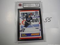Photo showing front of 1990-91 Score #338 Wayne Gretzky card graded 9.5 NGM inside protective slab.
