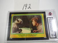 Photo of the 1980 OPC Star Wars trading card #332 with image of Luke Skywalker and Yoda, graded NM 7, encased in protective slab.