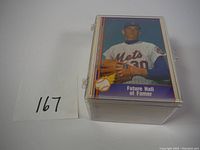 Stack of Nolan Ryan baseball cards in clear plastic holder showing front card with 'Future Hall of Famer' text