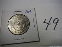 Reverse side of the coin showing the presidential seal and denomination.