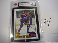Front of graded 1987-88 O-Pee-Chee Mark Messier hockey card showing player in Edmonton Oilers jersey, graded 9 MINT.