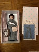 Full view of doll in original box with accessories and packaging