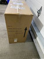 Box packaging with label indicating item is a gaming chair.