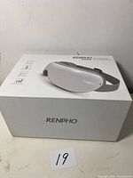 Photo of RENPHO eye massager box showing product branding and image of the device on the front.