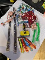 Top down view of all pet supplies showing collars, bandanas, grooming brush and toys.
