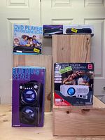 Full view of all four boxed items in the multimedia family bundle, showing product packaging and key product images.