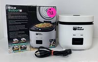 Photo of Rice Robot smart rice cooker, power cord, and original packaging box on white surface.
