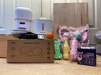 Full lot image showing all items including YUPOSL feeder, water fountain, pet bowls box, dog collar box, chew toys, and cat toy.