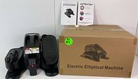 Photo of the packaged elliptical machine with box labeled 'Electric Elliptical Machine' alongside the device and paper instructions.