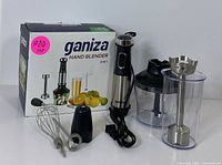 Complete Ganiza hand blender set with attachments and original box displayed on plain background.