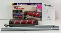 Voom cordless power sweeper handle tubes, product box, and instruction manual laid out flat