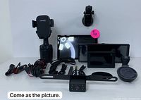 Photo showing full lot: car phone mount, two LCD camera display screens, rear camera, suction cup mount, wiring, and mounting accessories arranged on a white background.